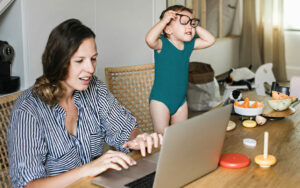 Woman struggling to deal with her kids while working from home